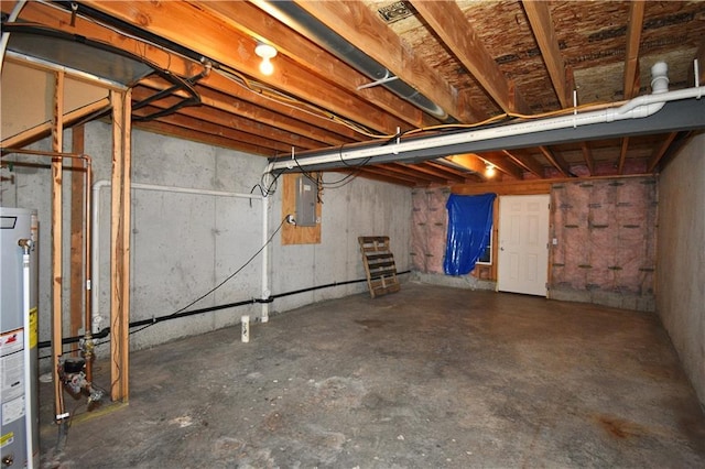 unfinished basement featuring water heater and electric panel