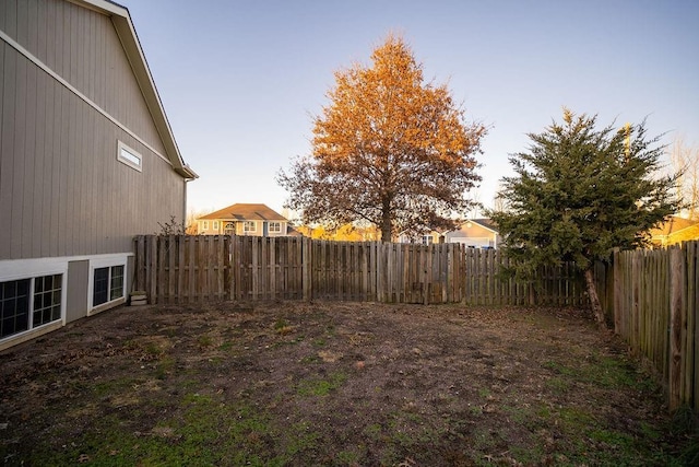 view of yard at dusk