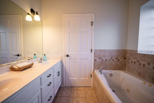 bathroom featuring vanity, tile patterned flooring, and a relaxing tiled tub