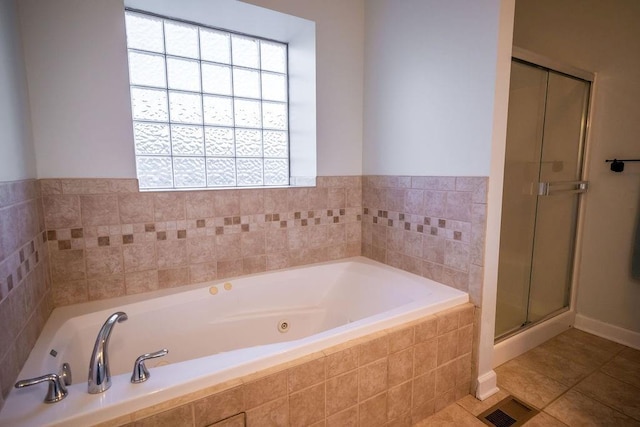 bathroom featuring plus walk in shower and tile patterned floors