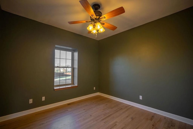 unfurnished room with ceiling fan and light hardwood / wood-style flooring