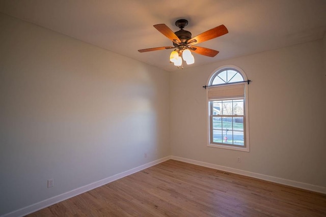 empty room with light hardwood / wood-style floors and ceiling fan