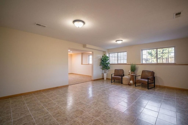 sitting room with tile patterned flooring