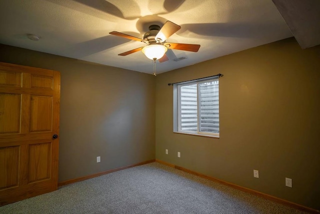 carpeted empty room with ceiling fan