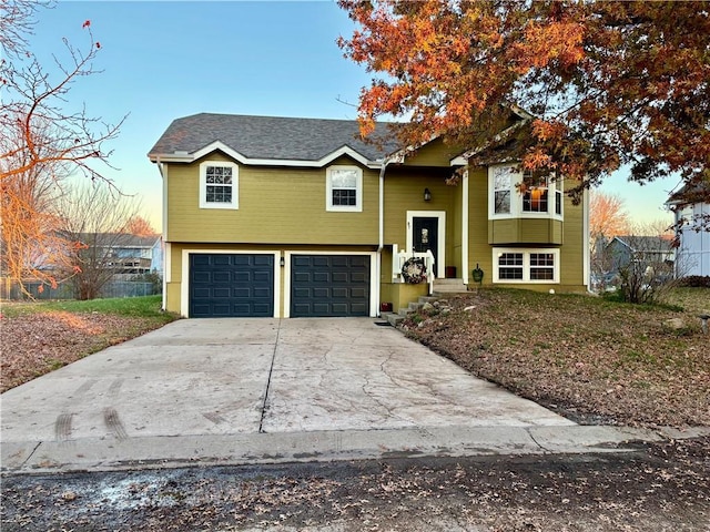 bi-level home featuring a garage