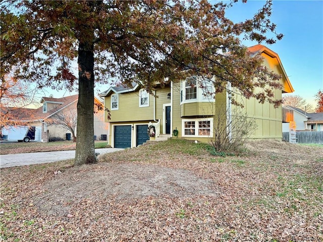 raised ranch featuring a garage