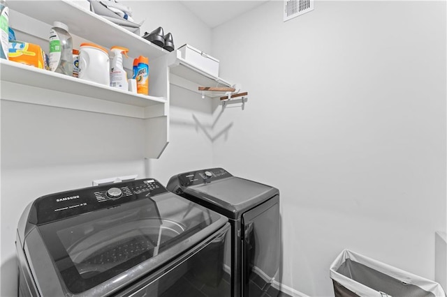 laundry room featuring separate washer and dryer