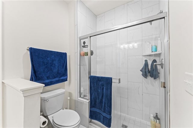 bathroom featuring walk in shower and toilet