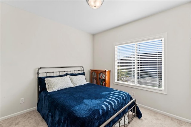 bedroom with light colored carpet