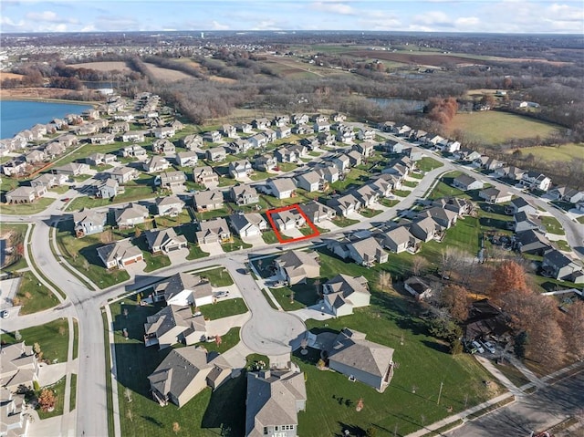 birds eye view of property featuring a water view