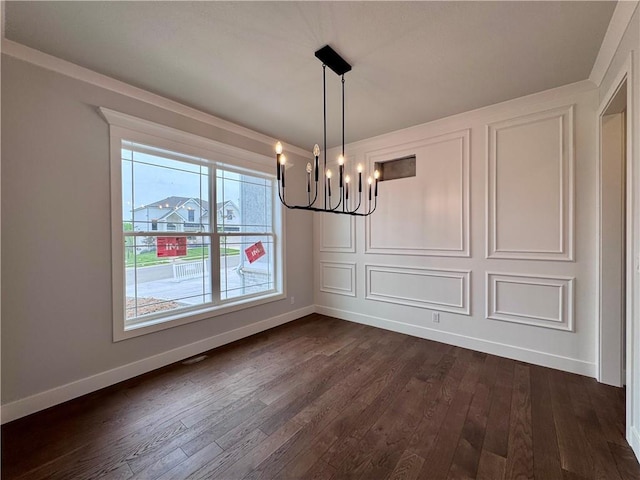 7601 NE 103rd Ter, Kansas City, MO 64157 - unfurnished dining area with a chandelier, dark wood-style flooring, and baseboards