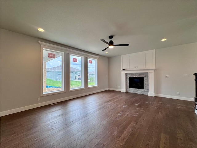 7601 NE 103rd Ter, Kansas City, MO 64157 - unfurnished living room with dark wood-style floors, a ceiling fan, baseboards, and recessed lighting