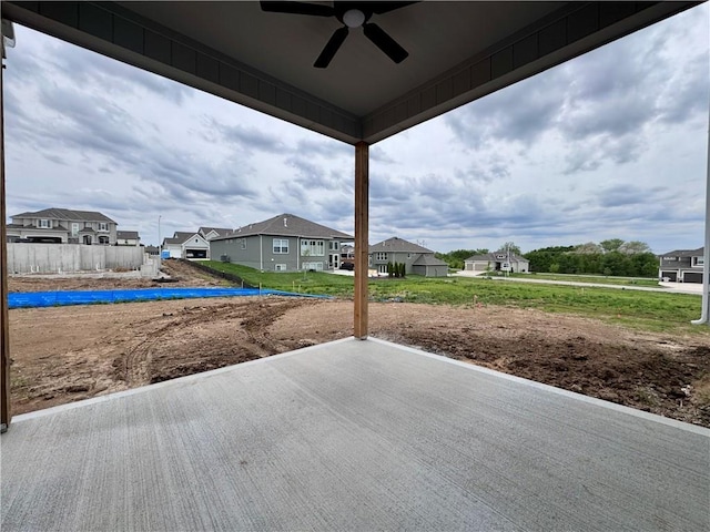 7601 NE 103rd Ter, Kansas City, MO 64157 - view of patio with a ceiling fan and a residential view