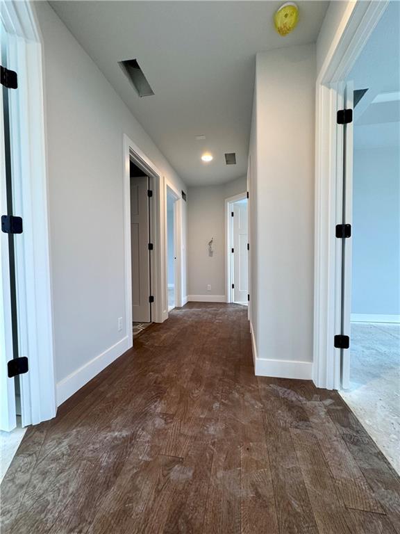 7601 NE 103rd Ter, Kansas City, MO 64157 - hall featuring wood finished floors and baseboards