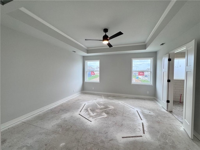 7601 NE 103rd Ter, Kansas City, MO 64157 - unfurnished bedroom featuring a raised ceiling, baseboards, and ceiling fan