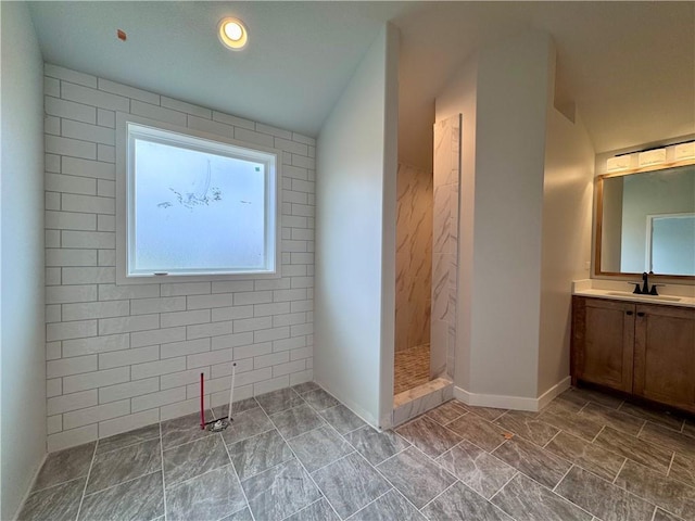 7601 NE 103rd Ter, Kansas City, MO 64157 - full bath with vanity, walk in shower, marble finish flooring, and baseboards