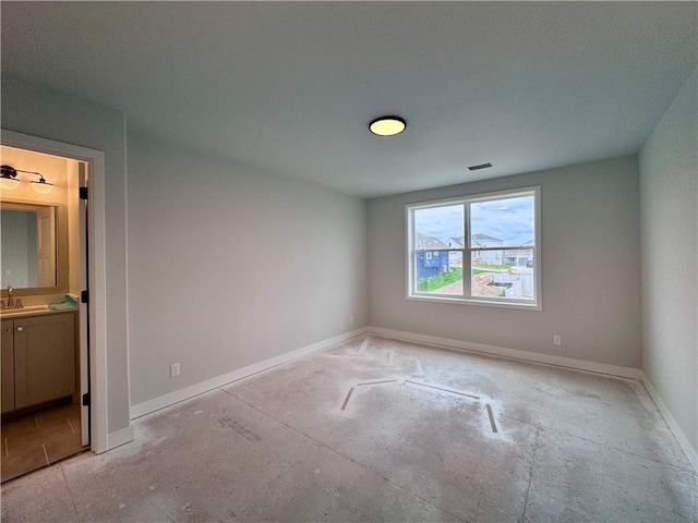 7601 NE 103rd Ter, Kansas City, MO 64157 - empty room featuring baseboards and a sink