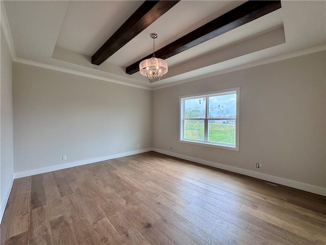 7719 NE 103rd Ter, Kansas City, MO 64157 - spare room with a chandelier, wood finished floors, baseboards, beamed ceiling, and crown molding