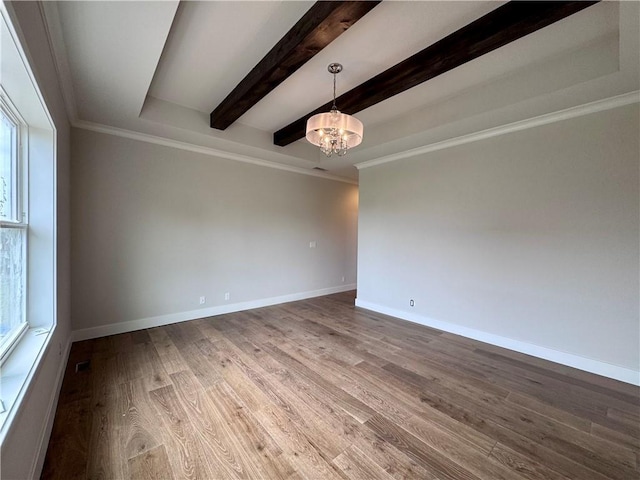 7719 NE 103rd Ter, Kansas City, MO 64157 - unfurnished room featuring a chandelier, wood finished floors, beamed ceiling, baseboards, and crown molding