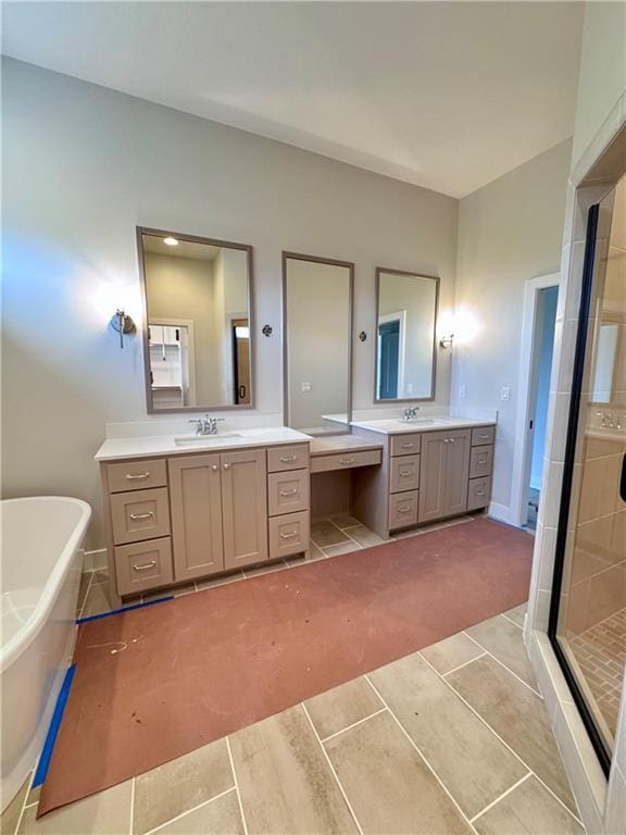 7719 NE 103rd Ter, Kansas City, MO 64157 - bathroom with a shower stall, tile patterned floors, a freestanding bath, and two vanities