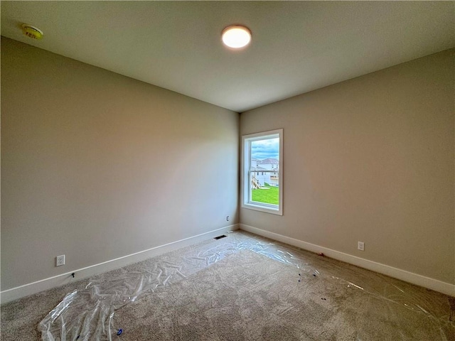 7719 NE 103rd Ter, Kansas City, MO 64157 - empty room with carpet floors, a smoke detector, and baseboards