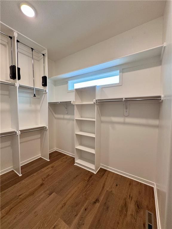 7719 NE 103rd Ter, Kansas City, MO 64157 - spacious closet with dark wood-style flooring