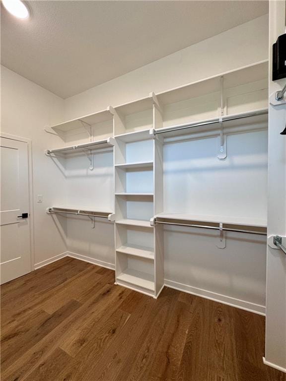 7719 NE 103rd Ter, Kansas City, MO 64157 - spacious closet featuring dark wood-style flooring