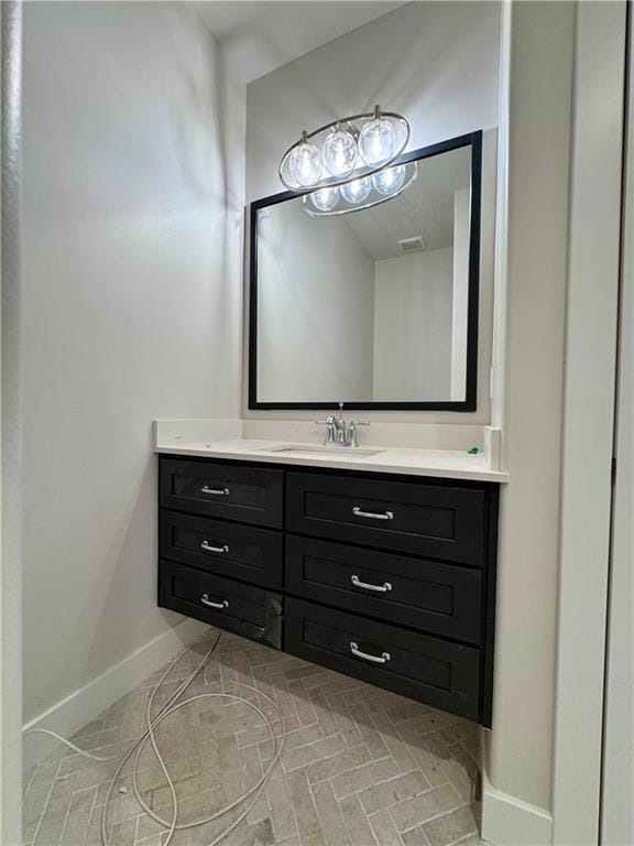 7719 NE 103rd Ter, Kansas City, MO 64157 - bathroom featuring vanity and baseboards
