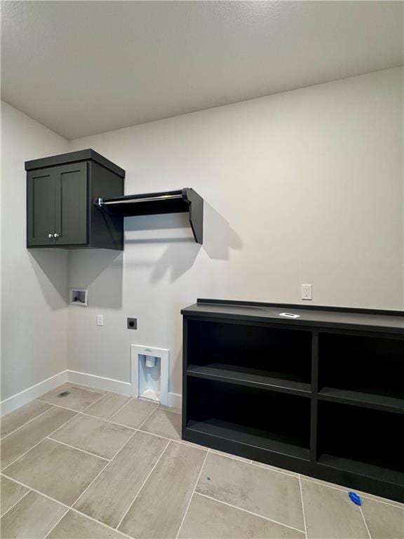 7719 NE 103rd Ter, Kansas City, MO 64157 - washroom with hookup for an electric dryer, cabinet space, hookup for a washing machine, and baseboards