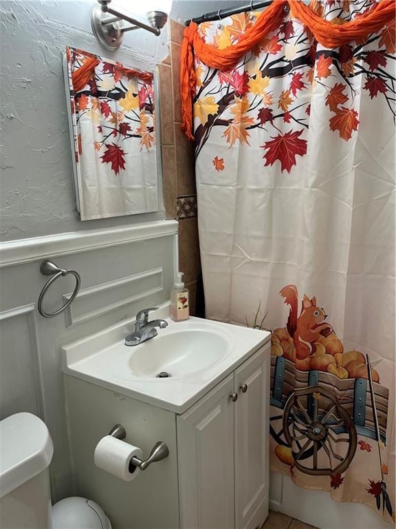 bathroom featuring vanity and toilet