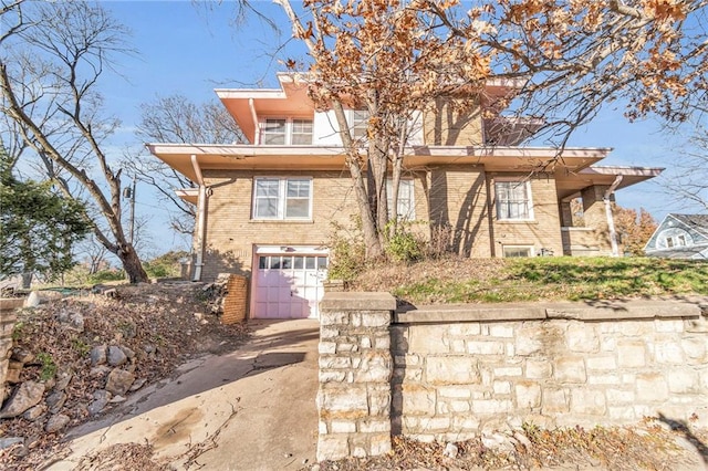 view of front of property with a garage