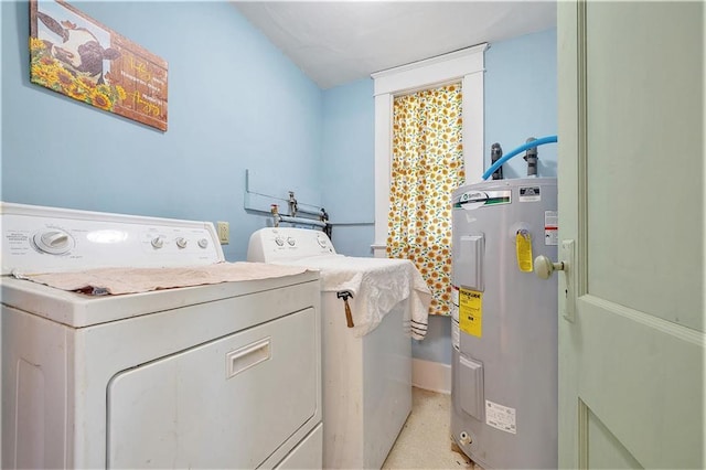 washroom with water heater and independent washer and dryer