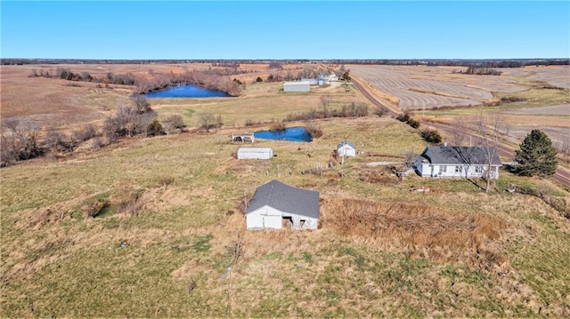 bird's eye view featuring a rural view and a water view