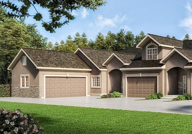 view of front of home featuring a garage and a front yard