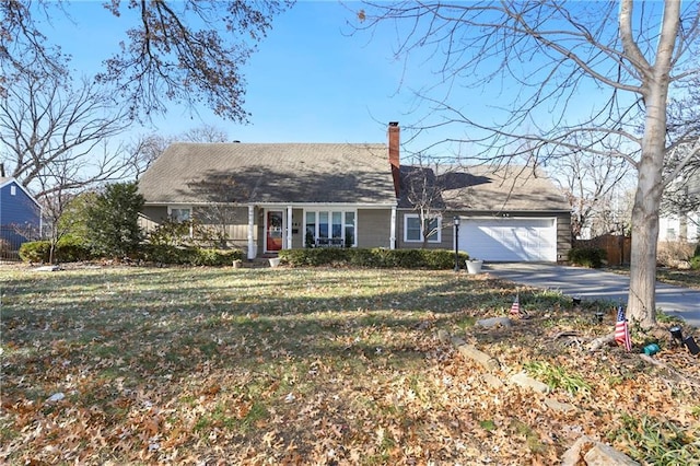 view of front facade with a front yard and a garage