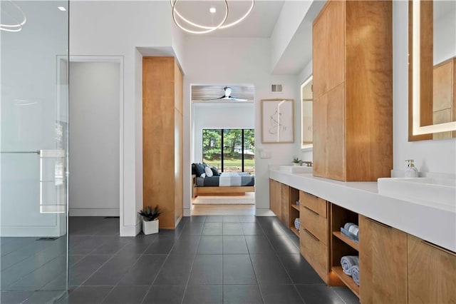 bathroom featuring tile patterned flooring, vanity, and ceiling fan