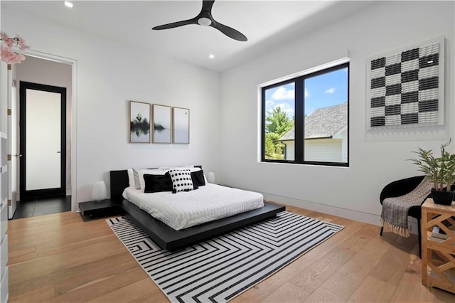 bedroom featuring light hardwood / wood-style floors and ceiling fan