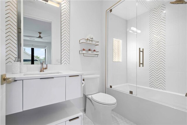 12604 W 160th St, Overland Park, KS 66062 - full bathroom featuring vanity, toilet, shower / bath combination with glass door, and ceiling fan