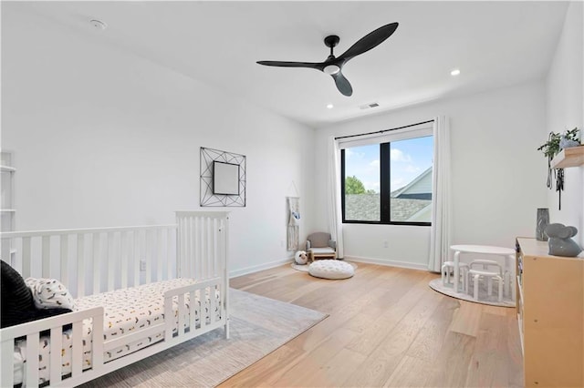 bedroom featuring ceiling fan and wood-type flooring