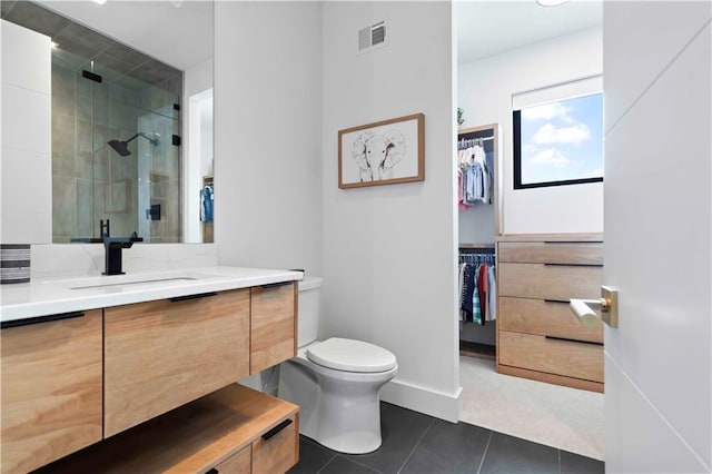 12604 W 160th St, Overland Park, KS 66062 - full bathroom featuring vanity, toilet, a stall shower, a walk in closet, and tile patterned flooring
