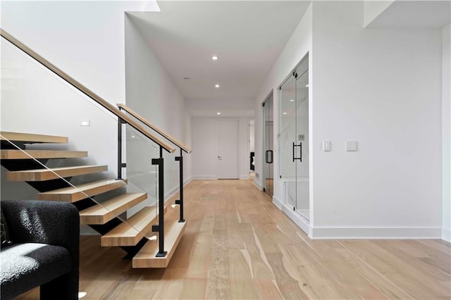 12604 W 160th St, Overland Park, KS 66062 - hall featuring stairs, light wood-type flooring, recessed lighting, and baseboards