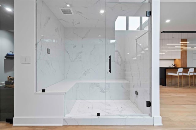 12604 W 160th St, Overland Park, KS 66062 - full bath featuring a marble finish shower, wood finished floors, and baseboards