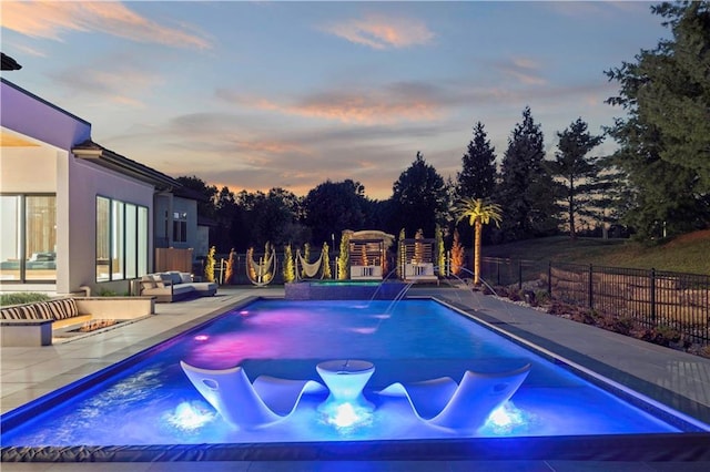 12604 W 160th St, Overland Park, KS 66062 - pool at dusk with a fenced backyard and a patio
