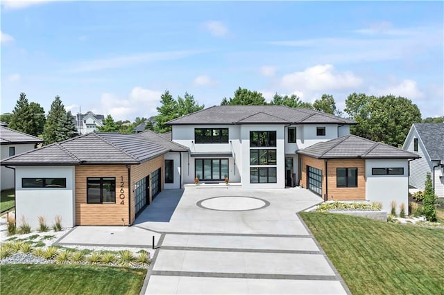 12604 W 160th St, Overland Park, KS 66062 - view of front of home featuring a front lawn, stucco siding, driveway, and a tile roof