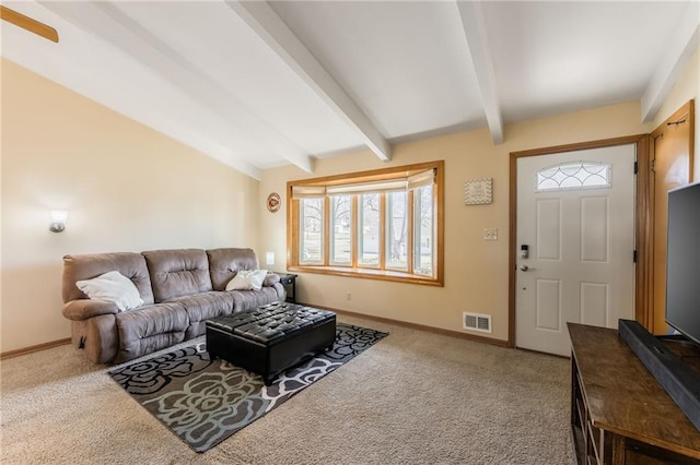 carpeted living area featuring visible vents, lofted ceiling with beams, and baseboards