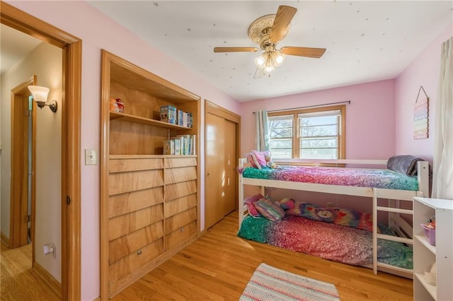 bedroom with wood finished floors and ceiling fan