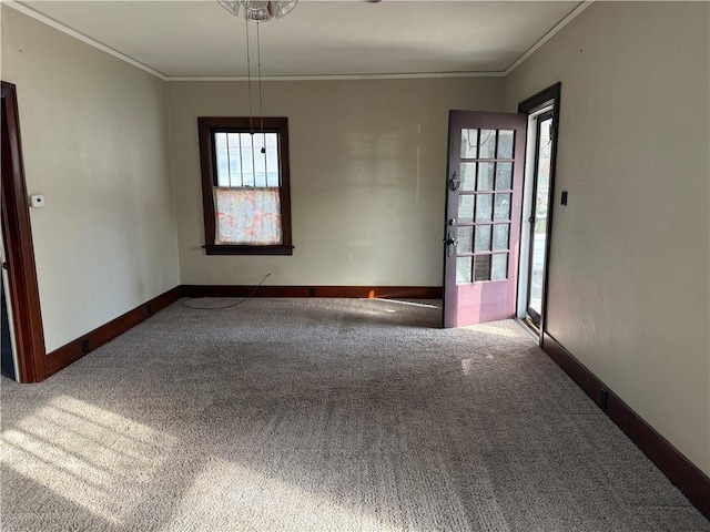 carpeted empty room with ornamental molding