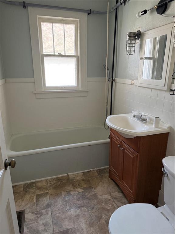 full bathroom with vanity, toilet, and shower / bath combination