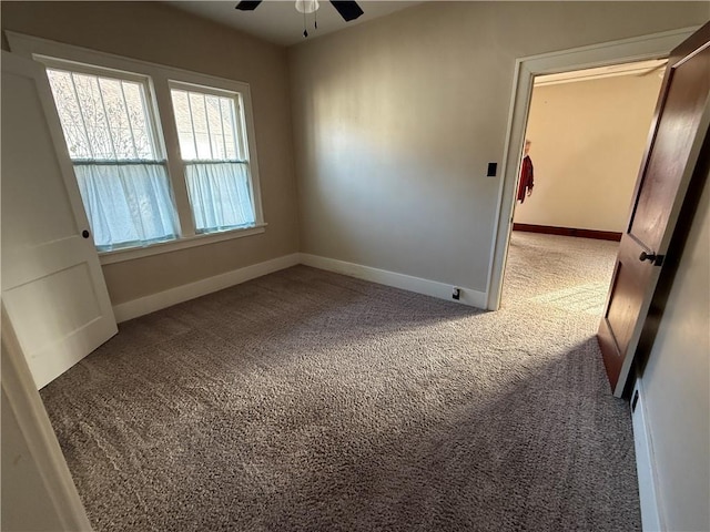 carpeted empty room with ceiling fan