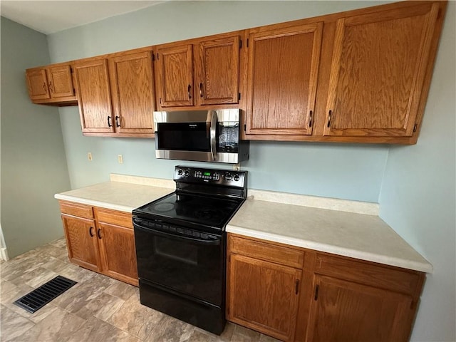 kitchen with black range with electric stovetop